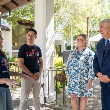 Roger and Debbie with students